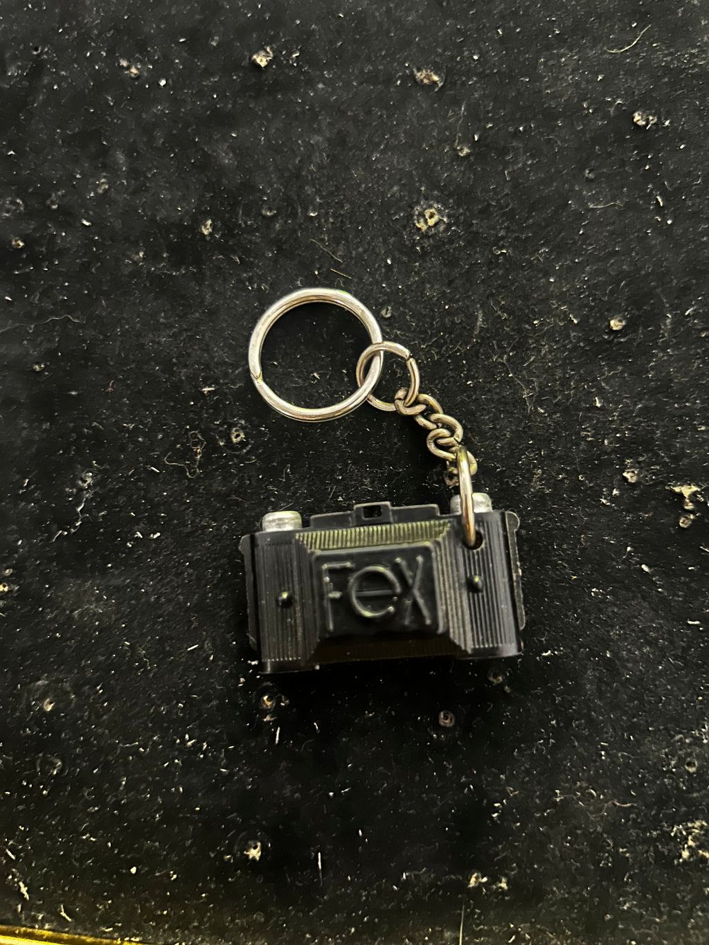 Porte clés FEX. Appareil photo