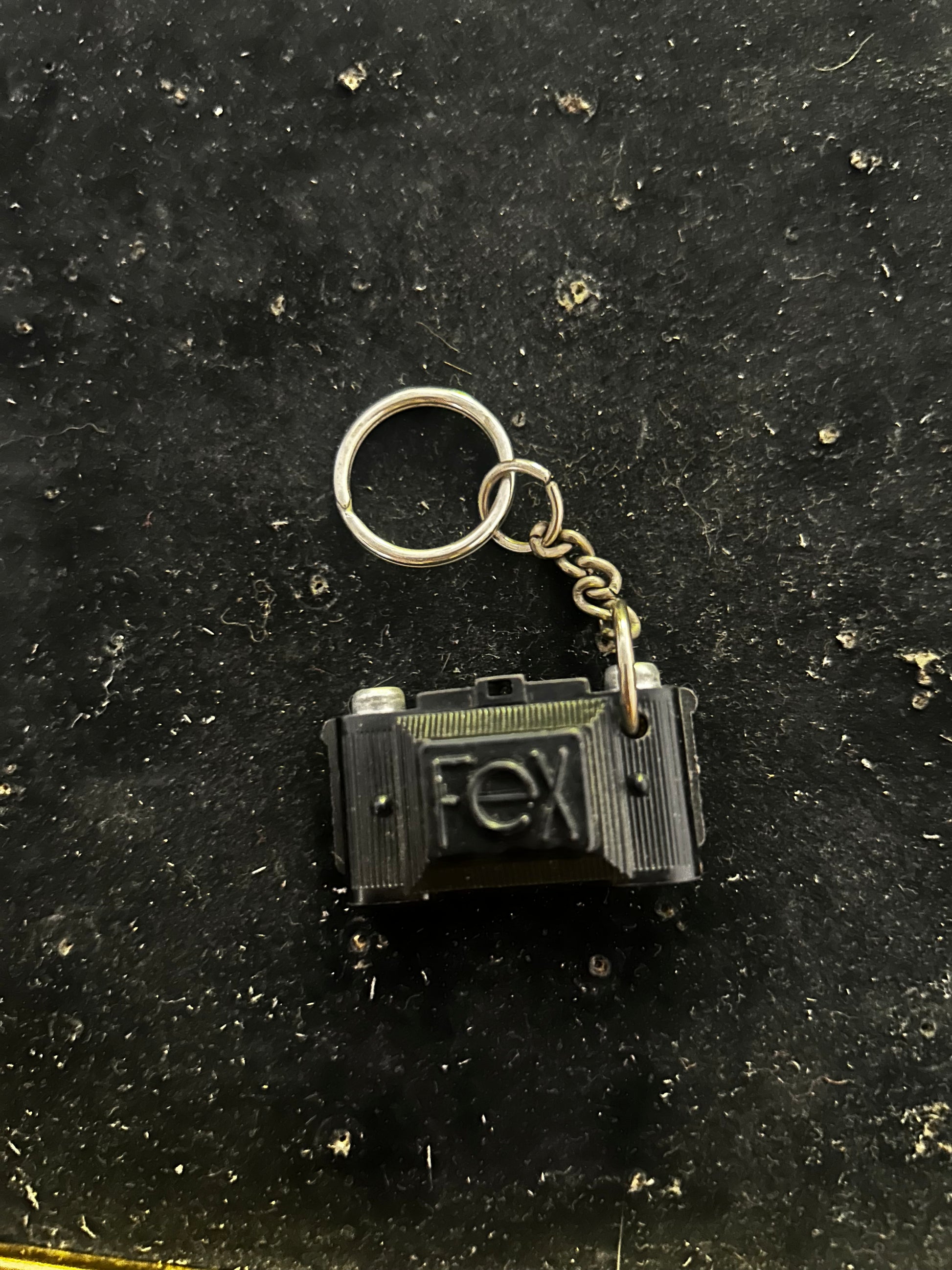 Porte clés FEX. Appareil photo